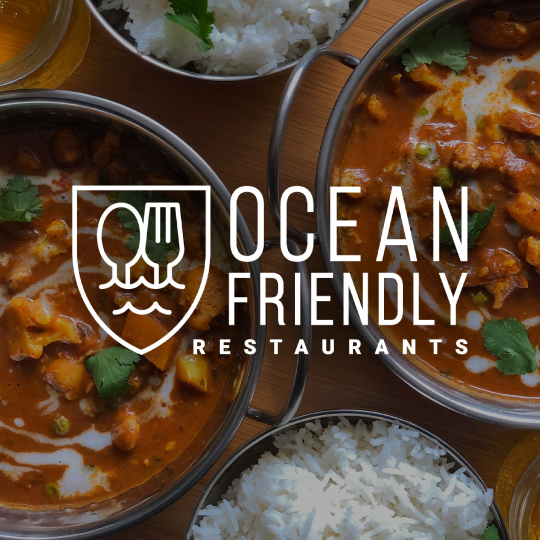 Ocean Friendly Restaurants logo over bowls of warm food